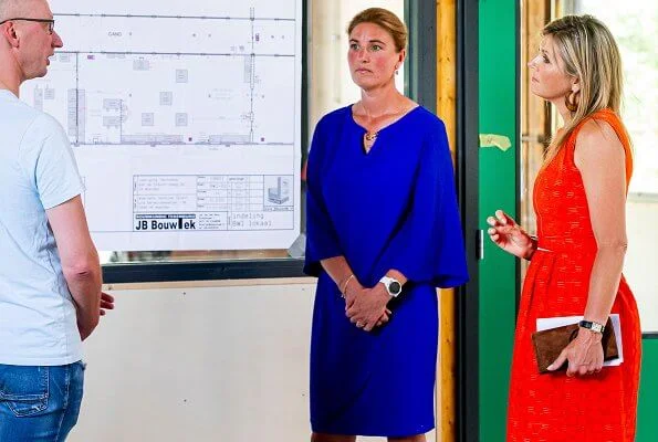 Queen Maxima wore a Natan summer dress in orange. The Queen visited technology facility TechnoHUB in Woerden