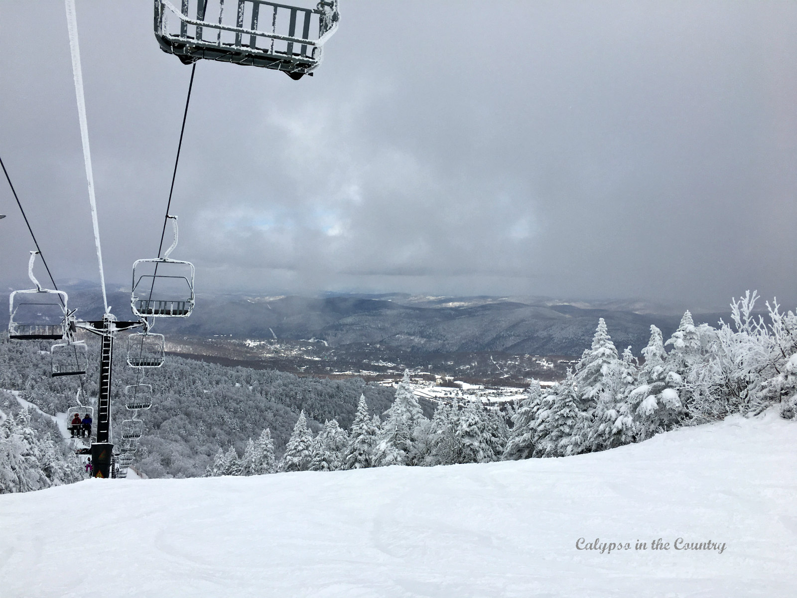 Ski lift and snowy mountain