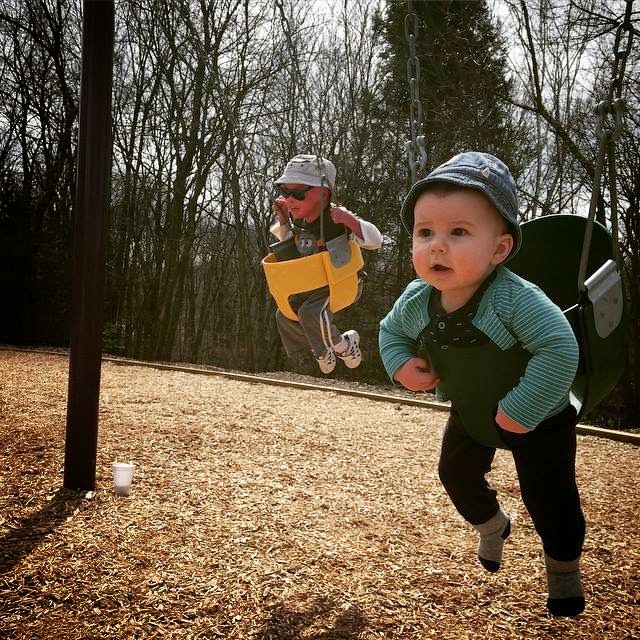 Evan, who has Harlequin Ichthyosis, with his brother in swings