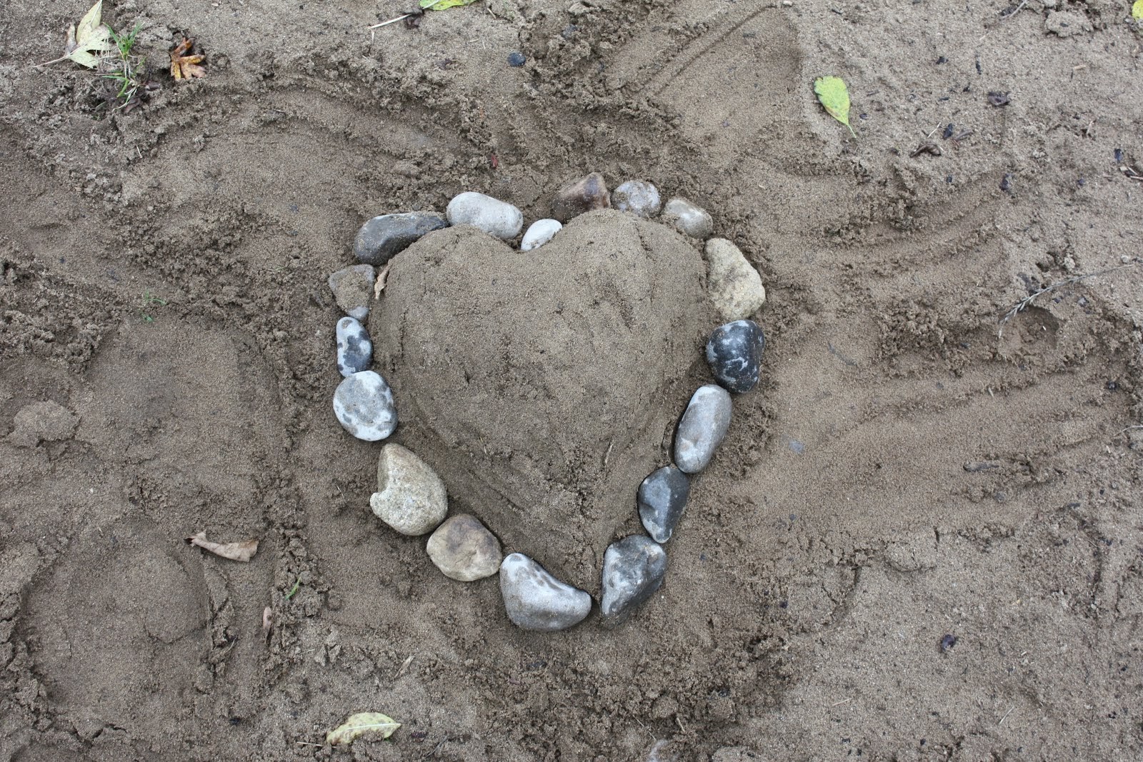 Making hearts in the sand...