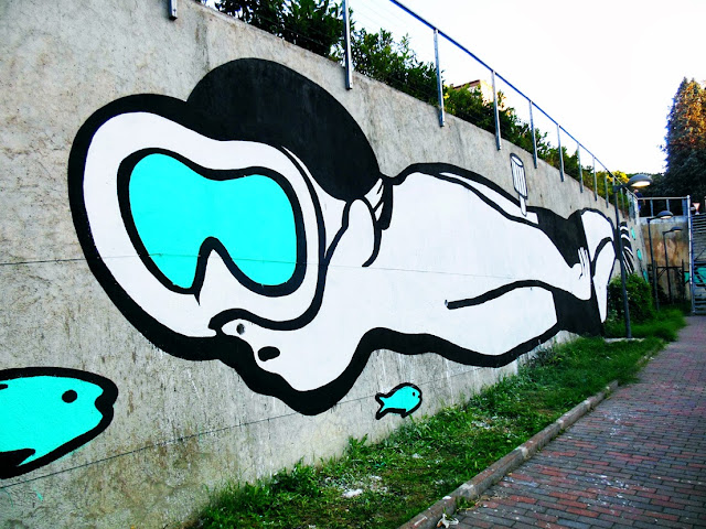 Italian Street Artist MP5 Paints a new mural entitled "Playing Upstream" in Terni, Italy. 6