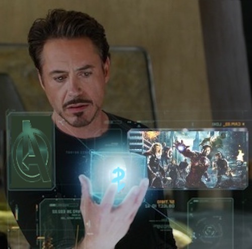 photo-illustration of Tony Stark holding Cosmic Cube with dollar sign amidst viewscreens depicting Avengers promotional images