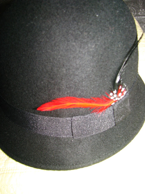 cloche hat with feather detail