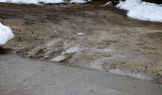 Muddy driveway by the parking area Muddy driveway by the parking area