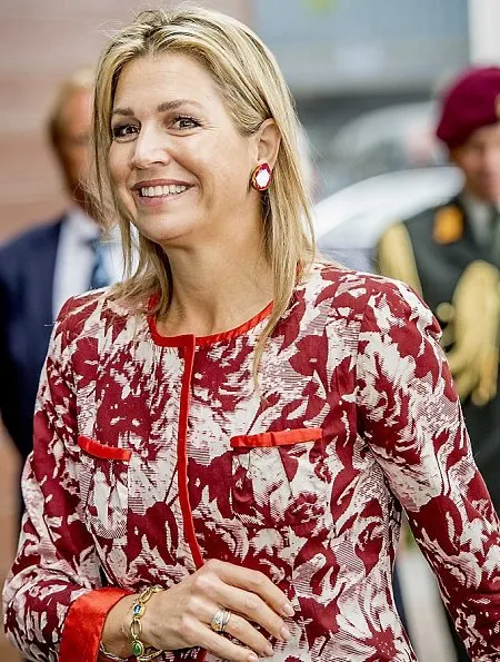 Queen Maxima wore Natan outfits, dress and coat, Natan shoes and carried A Bag With A Story Maharlika Snake Clutch