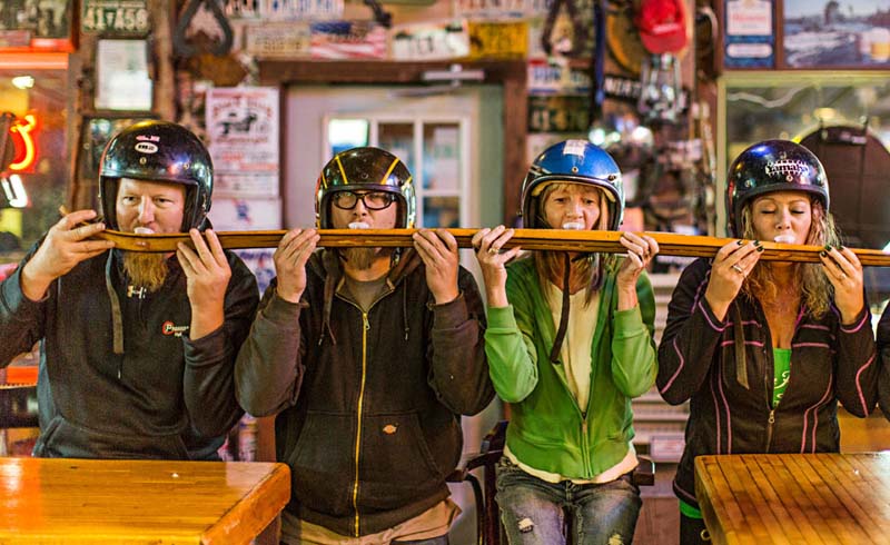 The “shotski,” a winter rite at Black Hills bars