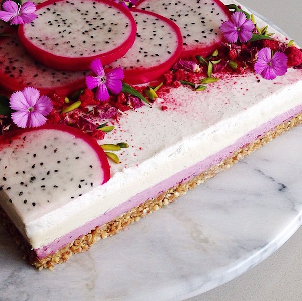 raw vegan cheesecake layer of mixed berry cream with flower