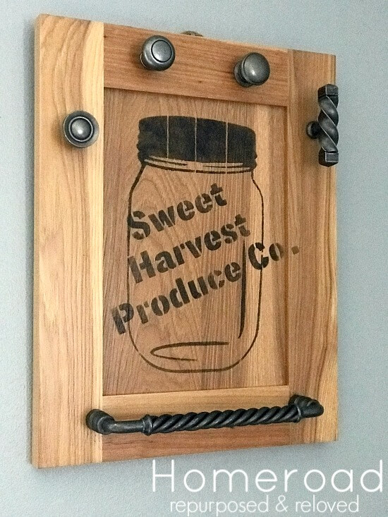 Cabinet door with knobs and handles. 