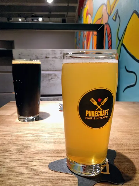 Pint of beer and a pint of Dunkerton's Craft Cider at Purecraft Bar and Kitchen in Birmingham England