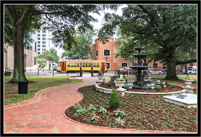 Metro Streetcar 410 is passing by the front gate of the Old State House Museum