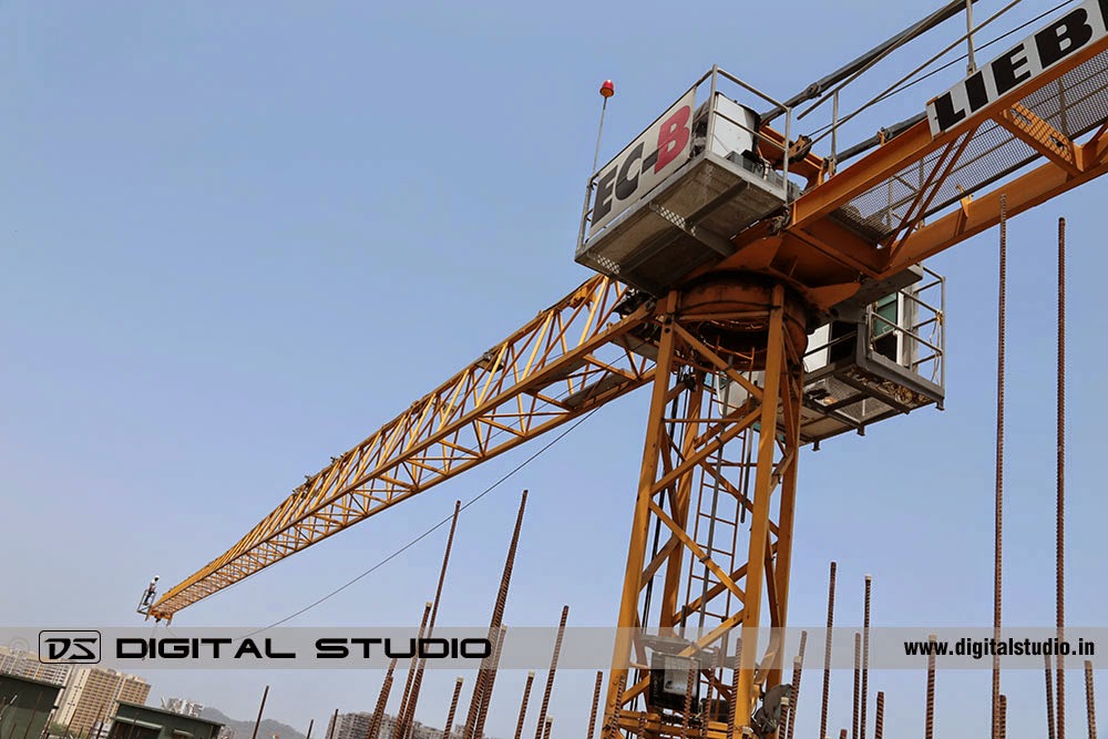 Worker working on a tower crane Worker working on a tower crane