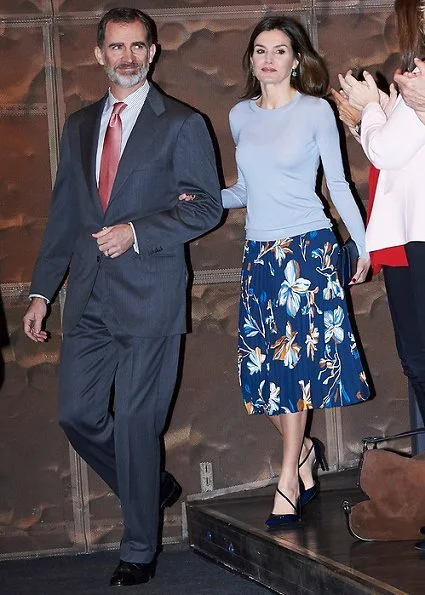 Queen Letizia wore Hugo Boss Fayme crew neck wool sweater and Hugo Boss Viplisa Skirt, Carolina Herrera sandals and she carries Hugo Boss clutch