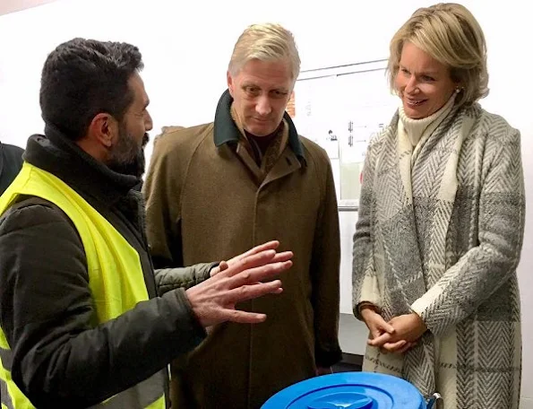 Queen Mathilde visits Pierre d'Angle, night shelter for homeless adults. Queen Mathilde wore Natan Coat