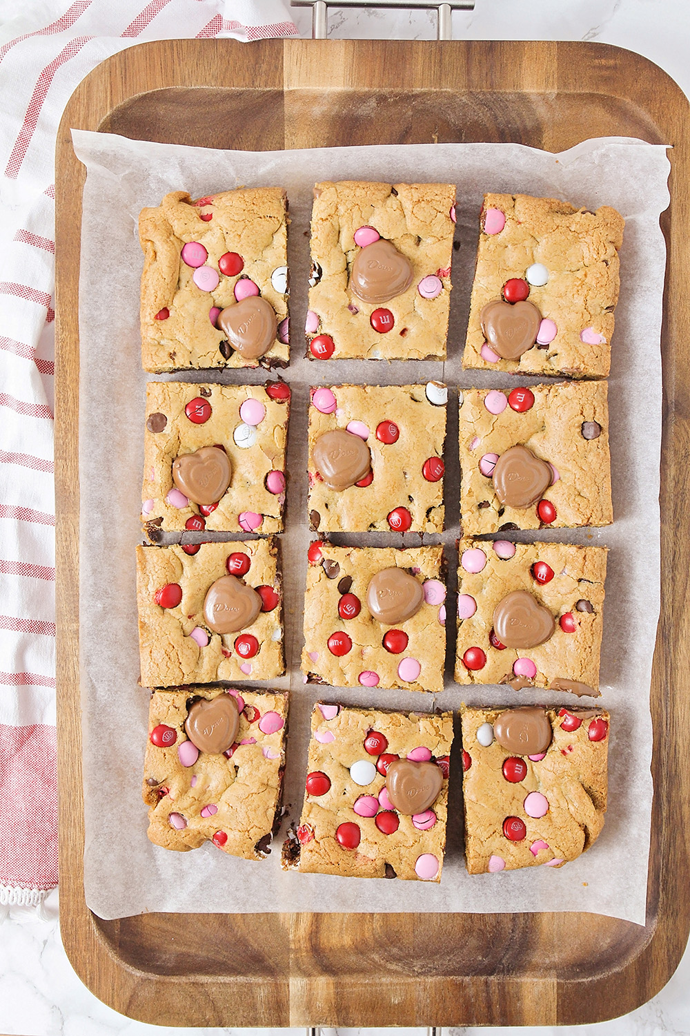 These adorable Valentine cookie bars are loaded with chocolate chips and M&M's. They're the perfect treat for your sweetheart!
