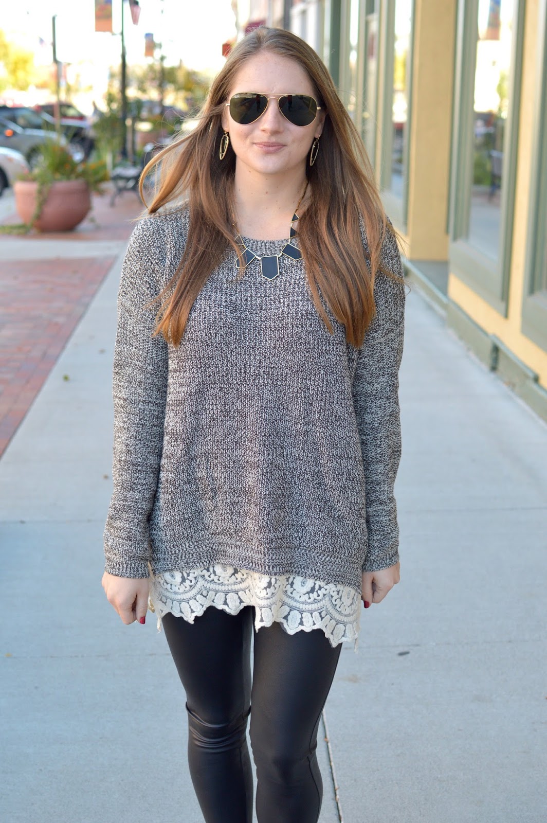 grey sweater with lace trim over leggings