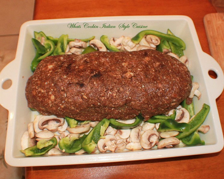 This is Italian flavored meatloaf stuffed with spinach, boiled eggs with tomato sauce rolled up and baked in the oven. This is a gourmet meatloaf that is worth the time and effort and delicious