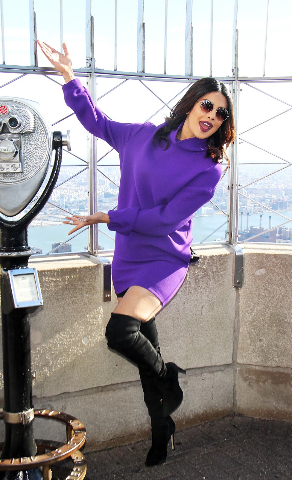 Priyanka Chopra Looks Sexy In a Purple Short Dress and Black Thigh High Boots During â€œQuanticoâ€ Promotion at The Empire State Building in New York City