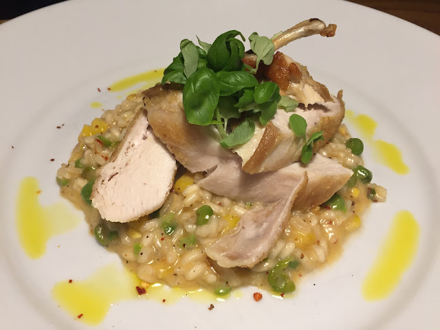 Pan-roasted chicken supreme, sweetcorn, chilli & pea risotto with Mrs Middleton’s cold-pressed lemon oil.