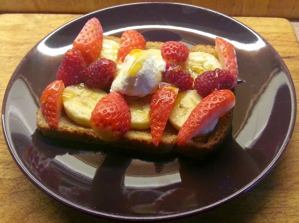 Fresh fruit and berries, ricotta and honey on toast