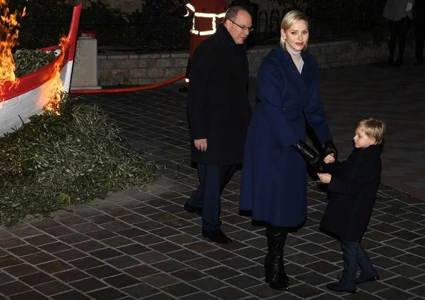 Prince Albert, Princess Charlene, Princess Gabriella and Prince Jacques attended Saint Devota event. royal blue cahmere wool coat