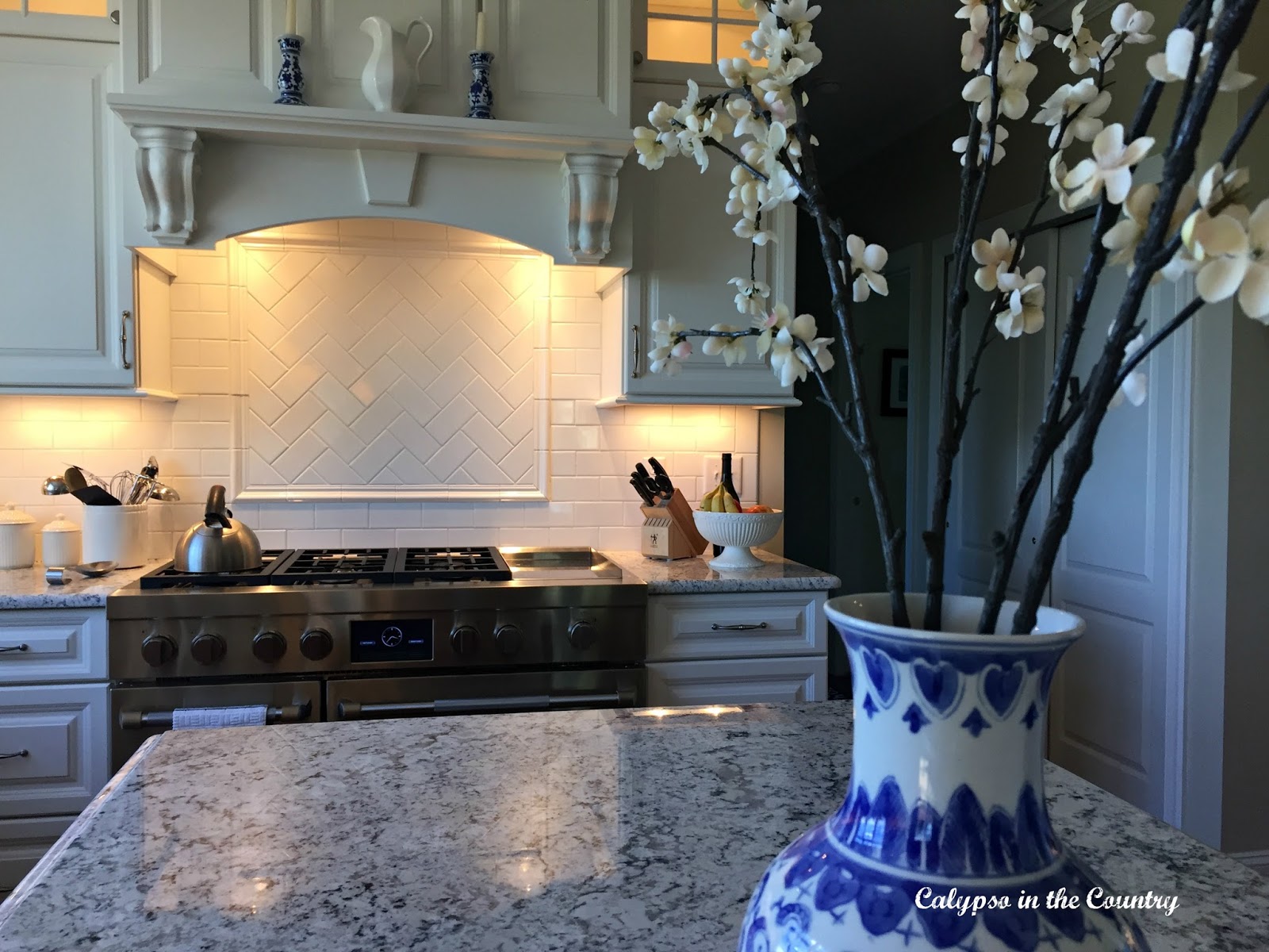 White kitchen with blue and white accessories