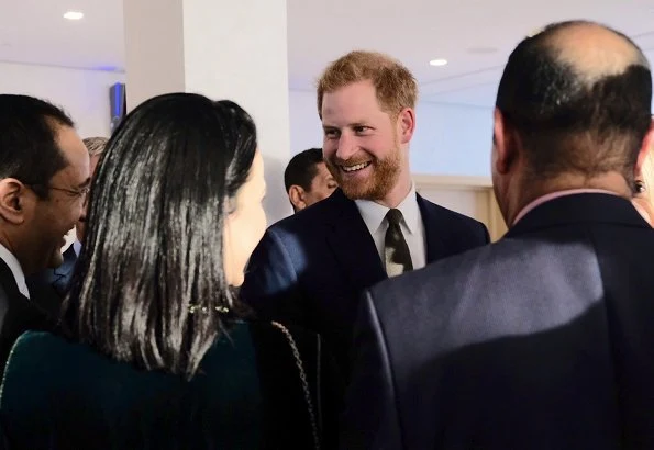 Meghan Markle wore a bespoke dress by Dior featuring draped sleeves and Birks Snowflake Snowstorm diamond earrings