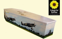 colourful coffins with pictures on outside