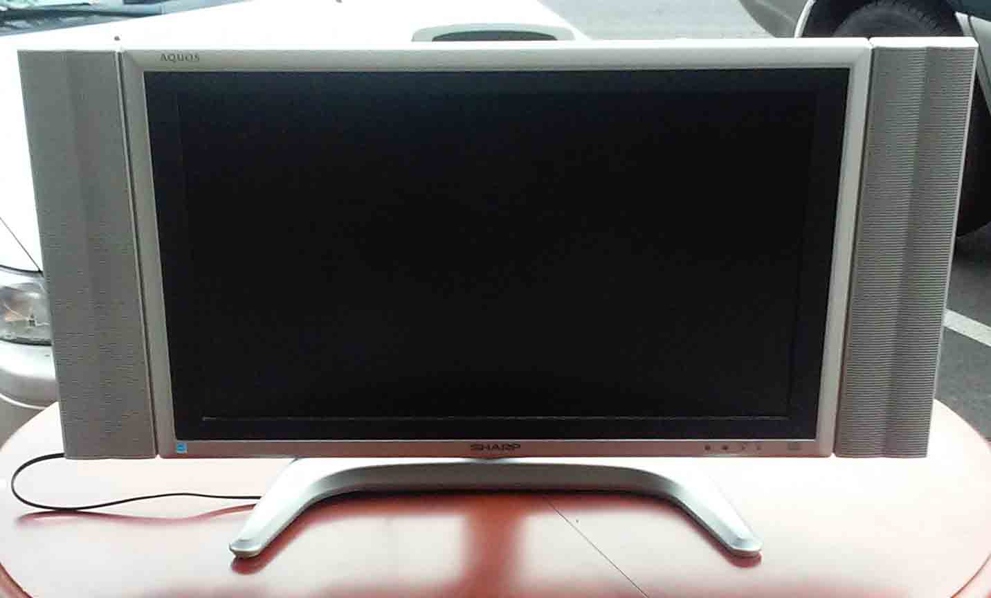 UHURU FURNITURE & COLLECTIBLES SOLD 25" Sharp Acquos TV (no remote) 95