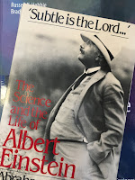 Subtle is the Lord: The Science and the Life of Albert Einstein,  by Abraham Pais. superimposed on Intermediate Physics for Medicine and Biology.