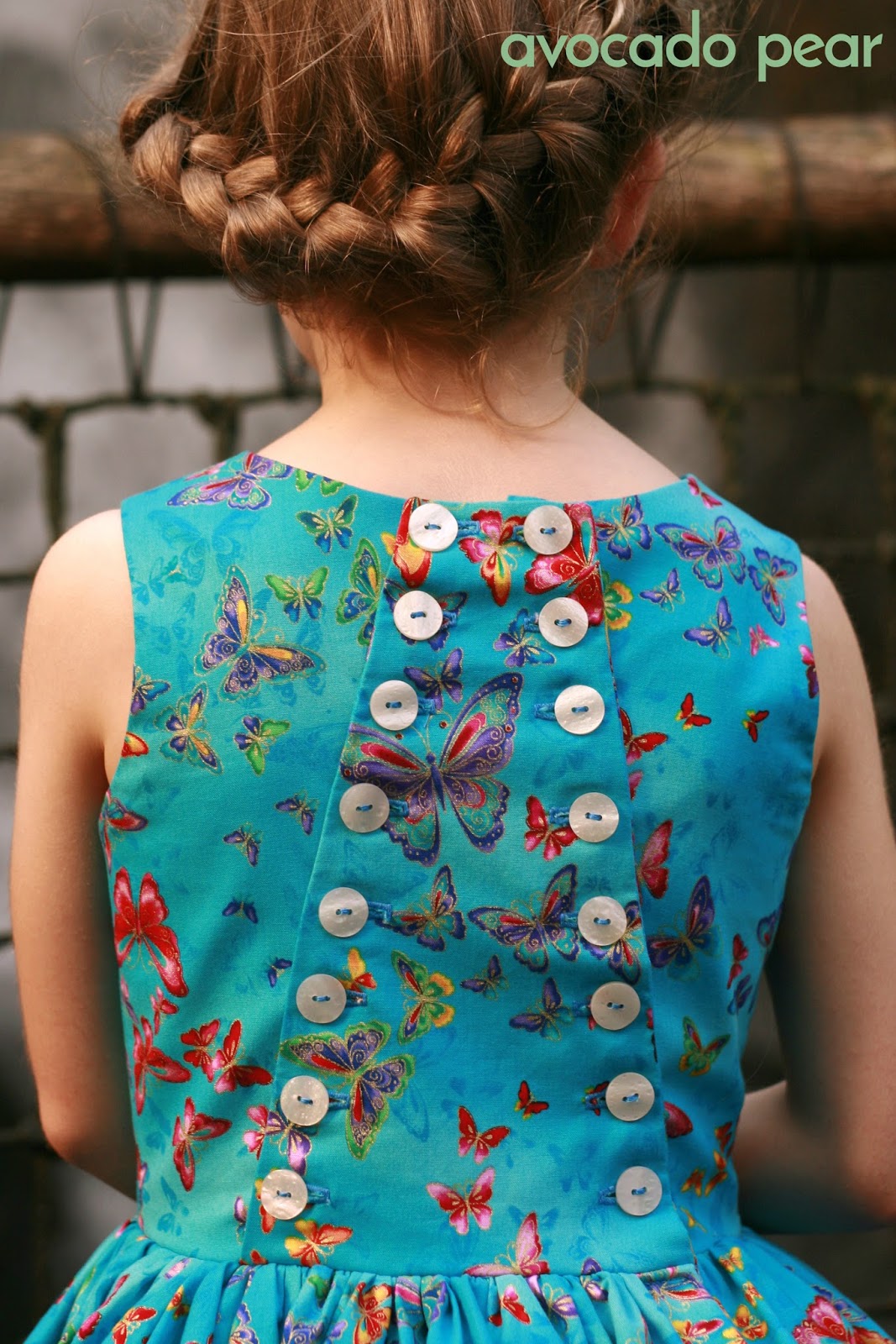 Latona girls dress blue butterflies button back view named full back view of latona party dress button back