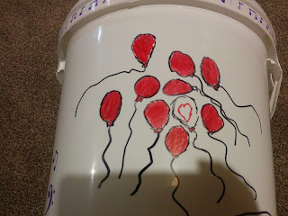 Red Balloons sharpie drawing on a Guides Camp Bucket