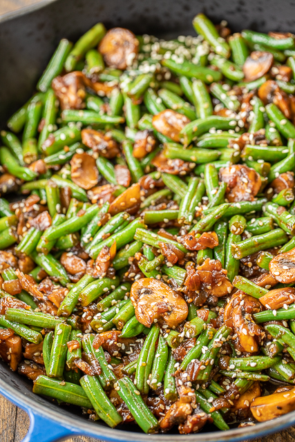 Teriyaki Green Beans - our favorite green bean recipe. SO delicious!! Green beans, shallot, mushrooms, garlic, teriyaki sauce and sesame seeds. Ready to eat in about 15 minutes. Great weeknight side dish! #sidedish #easysidedish #greenbeans #mushrooms Teriyaki Green Beans - our favorite green bean recipe. SO delicious!! Green beans, shallot, mushrooms, garlic, teriyaki sauce and sesame seeds. Ready to eat in about 15 minutes. Great weeknight side dish! #sidedish #easysidedish #greenbeans #mushrooms