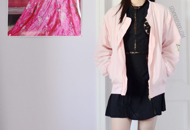 SheIn Fashion Review: Pastel Pink Bomber Jacket Details on the oversized pastel pink bomber jacket from SheIn, featuring front pockets and a badge/patch embellishment for a cute streetwear look.