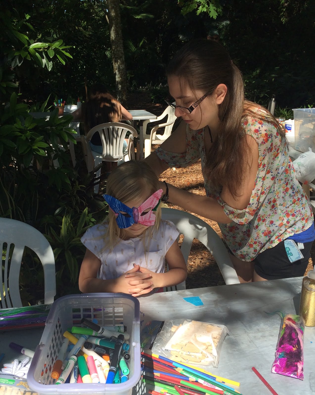 Perfectly Amusing Lilah making butterfly mask at USF plant sale