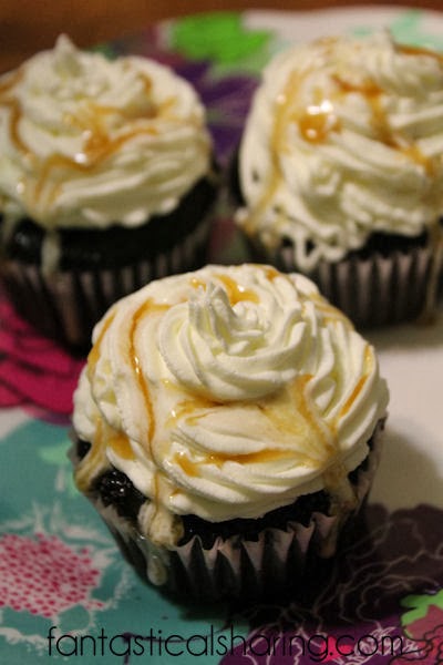Caramel Frappuccino Cupcakes | Moist chocolate cupcakes with a caramel center topped with whipped cream and caramel sauce