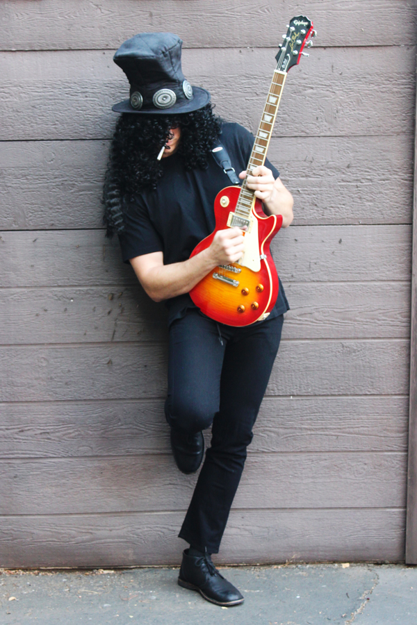 Slash costume: top hat, wig, cigarette, all black everything & a Les Paul