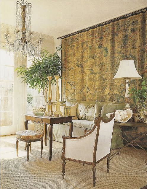 Pamela Pierce designed living room with tapestry and crystal chandelier.