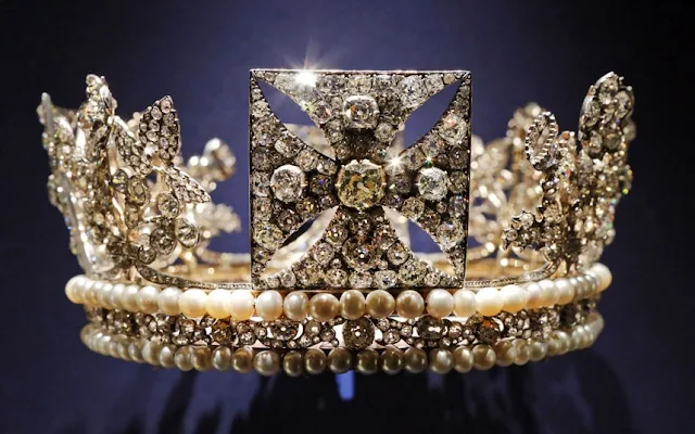 Alongside official black and white photographs the exhibition features private movies filmed behind the scenes for the Queen, that show the personal story behind the pomp and ceremony. Above, the diamond diadem, made of diamonds, pearls, silver and gold, worn by Queen Elizabeth II on her way from Buckingham Palace to Westminster Abbey for her 1953 Coronation.