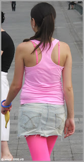 Girl in skirt and pink top