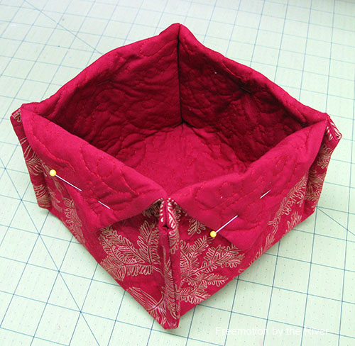 Hand stitch the flaps down on the basket Hand stitch the flaps down on the basket