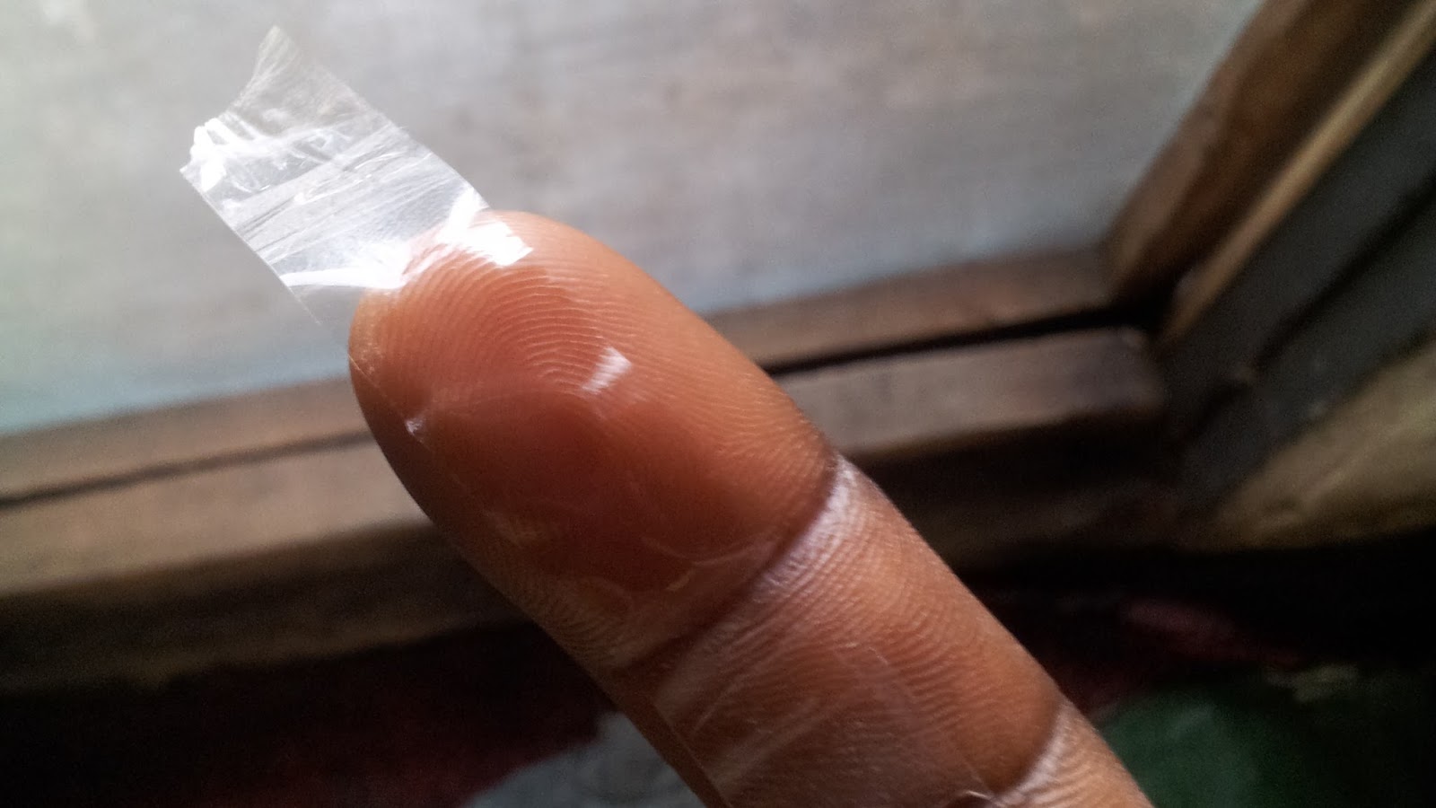 sellotape pasted on registered finger