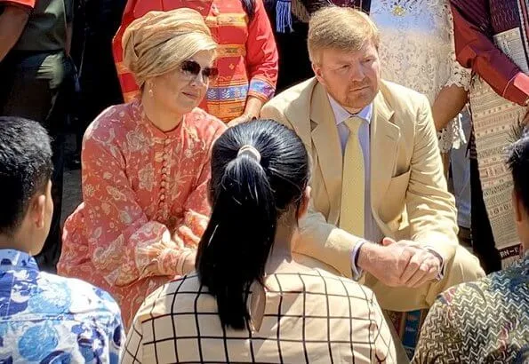 Queen Maxima wore Zimmermann Veneto border paisley print linen dress. Maxima visited a traditional Batak village and Del Institute