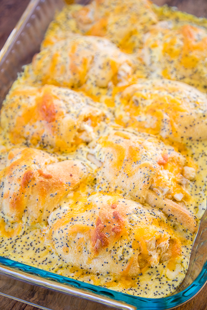 Poppy Seed Chicken Roll Ups - heaven in a pan!! Chicken and cream cheese wrapped in crescent rolls and topped cream of chicken soup, milk, cheese and poppy seeds. These are on the menu at least once a month! Everyone gobbles these up - we never have any leftovers. Our family's favorite chicken casserole!! #casserole #chicken #chickencasserole #chickenrecipes #easydinnerrecipe Poppy Seed Chicken Roll Ups - heaven in a pan!! Chicken and cream cheese wrapped in crescent rolls and topped cream of chicken soup, milk, cheese and poppy seeds. These are on the menu at least once a month! Everyone gobbles these up - we never have any leftovers. Our family's favorite chicken casserole!! #casserole #chicken #chickencasserole #chickenrecipes #easydinnerrecipe