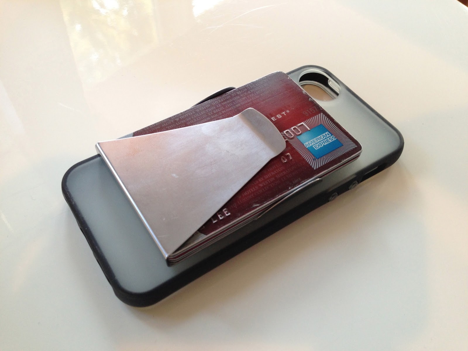 Product Idea Low profile, self adhesive, metal credit card case for