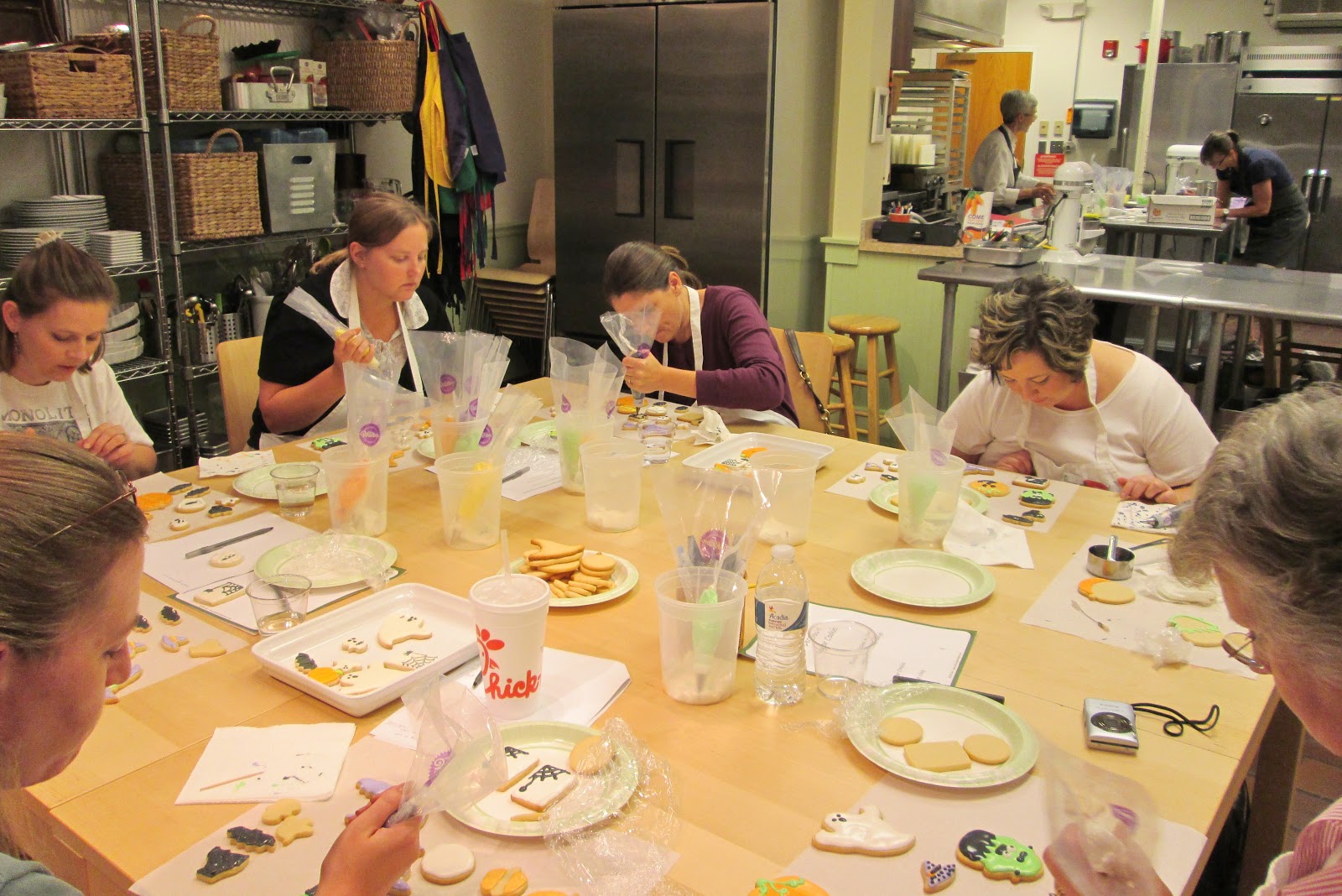 Students decorating their cookies