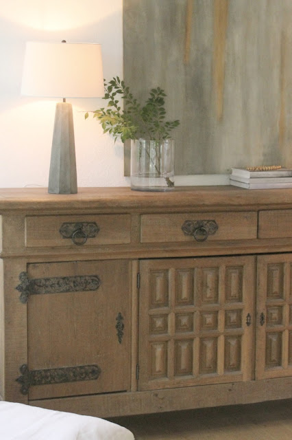 Rustic oak Belgian antique cupboard in European country styled living room by Hello Lovely Studio
