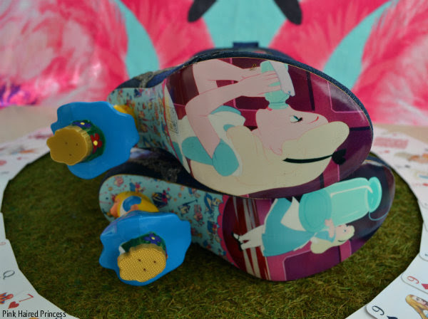 Irregular Choice Alice Lost Your Muchness soles soles of Irregular Choice Lost Your Muchness boots showing stills from Disney Alice In Wonderland