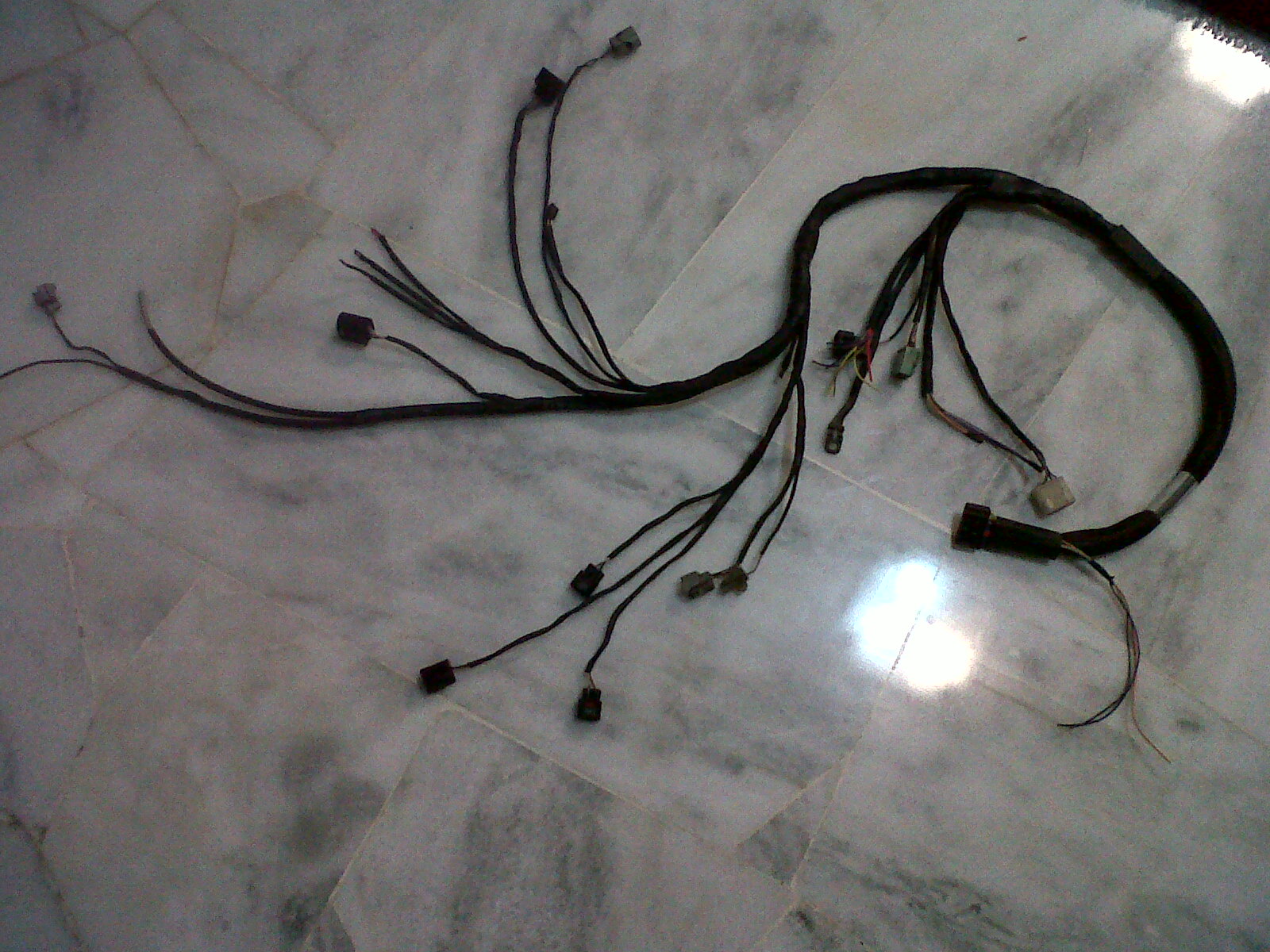 Above is the Sprint500 wiring harness and below is the stock Daihatsu EFRL engine harness.