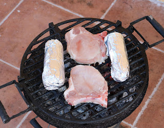 Corn on the cob and pork chops on the BBQ Corn on the cob and pork chops on the BBQ