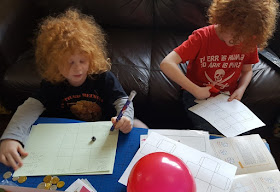 boys working on numberbundle activities